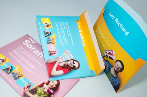 personalised direct mail printing in green, blue and orange branding